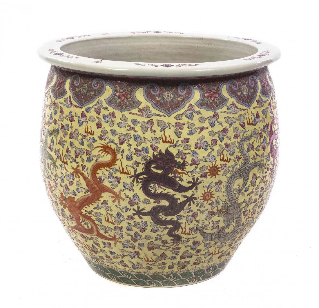 A Chinese Polychrome Decorated Ceramic Fish Bowl,: A Chinese Polychrome Decorated Ceramic Fish Bowl, depicting sinuous dragons and ruyi clouds on a yellow ground, having alternating ruyi and lappet reserves below the mouth rim, with a band of crashing