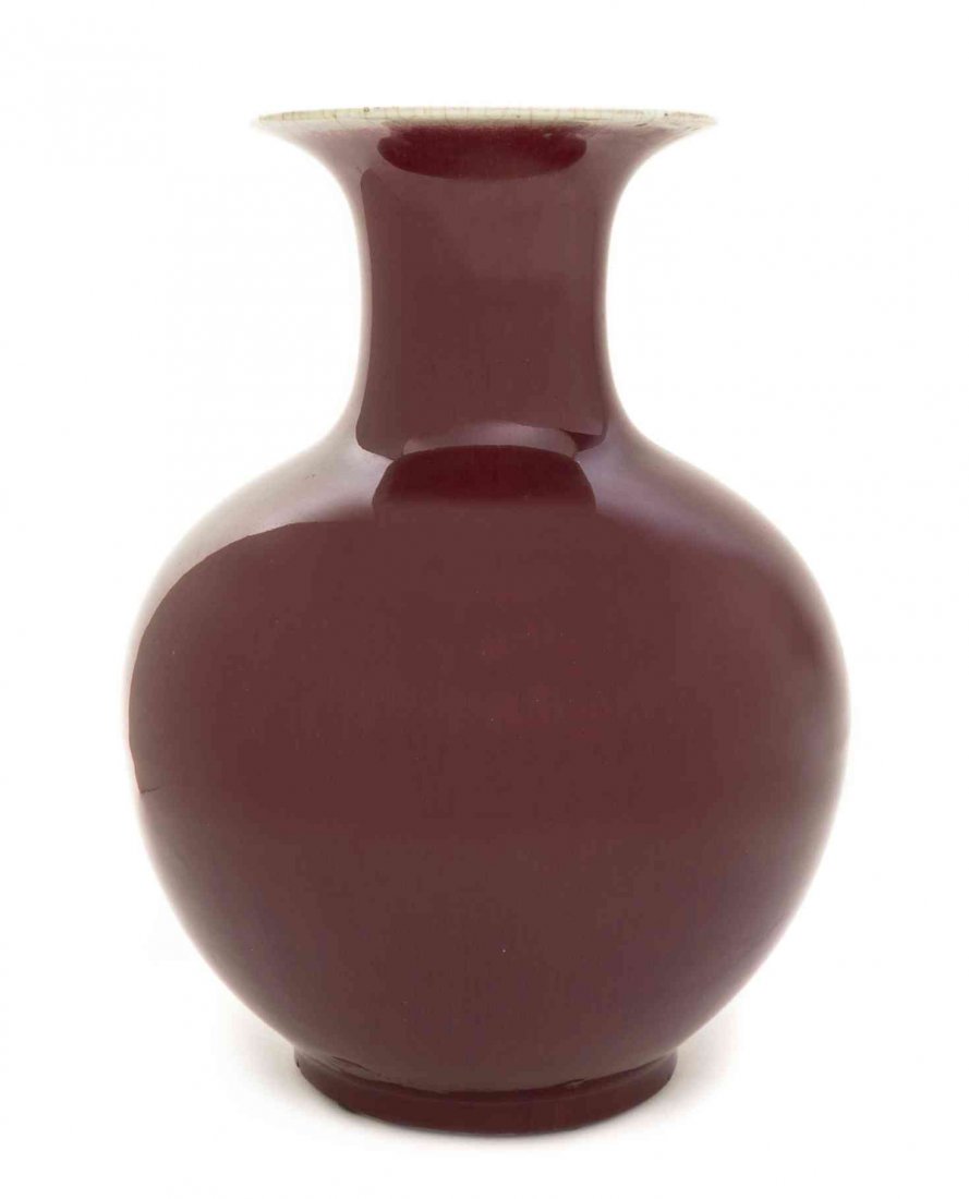 A Sang de Boeuf Glaze Baluster Vase, Height 12 3/4: A Sang de Boeuf Glaze Baluster Vase, 19th century, the flared mouth rim with thin glaze, above the globular body and recessed circular foot. Height 12 3/4 inches.