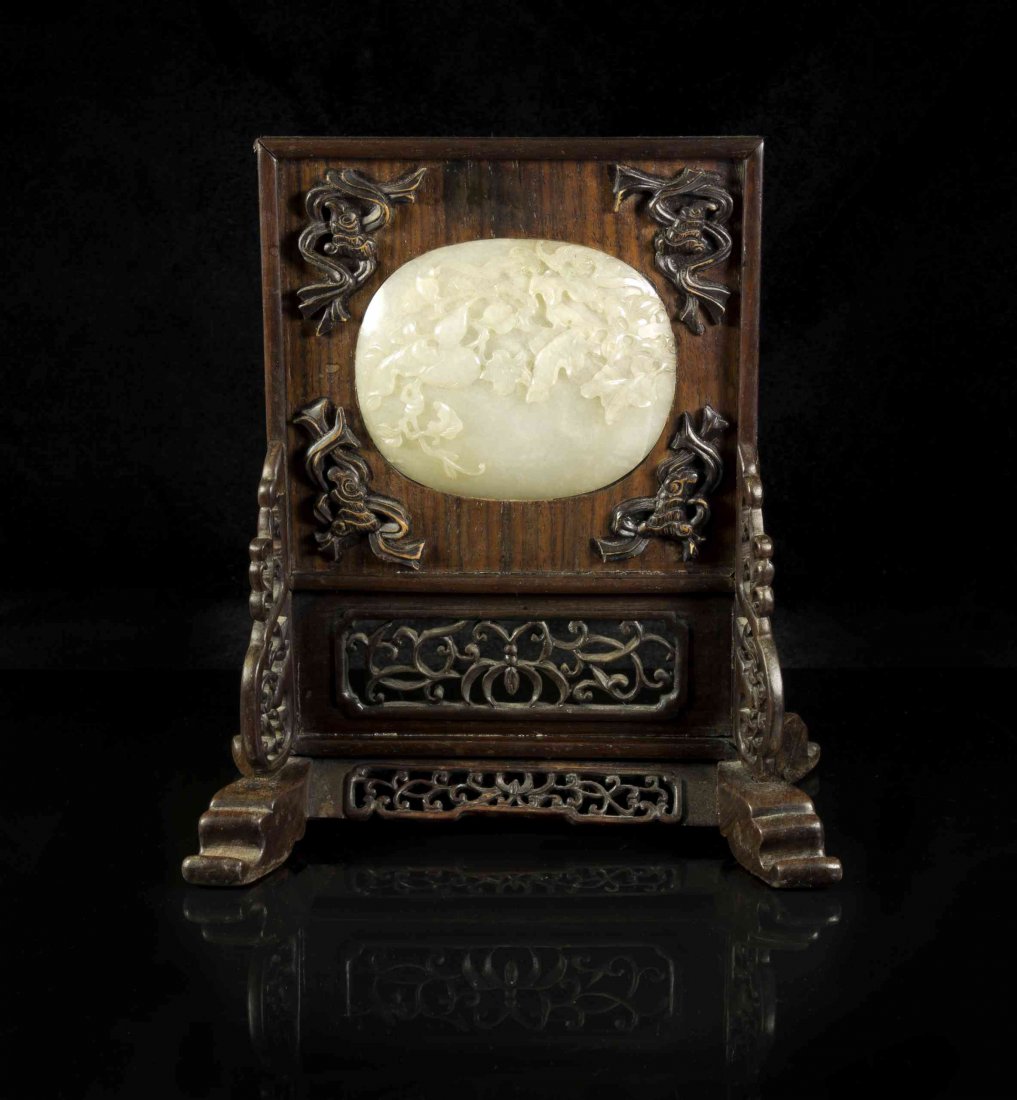 A Near White Jade Plaque, Width 3 1/2 inches.: A Near White Jade Plaque, likely from a ruyi scepter, mounted in wood as a tablescreen. Width 3 1/2 inches.