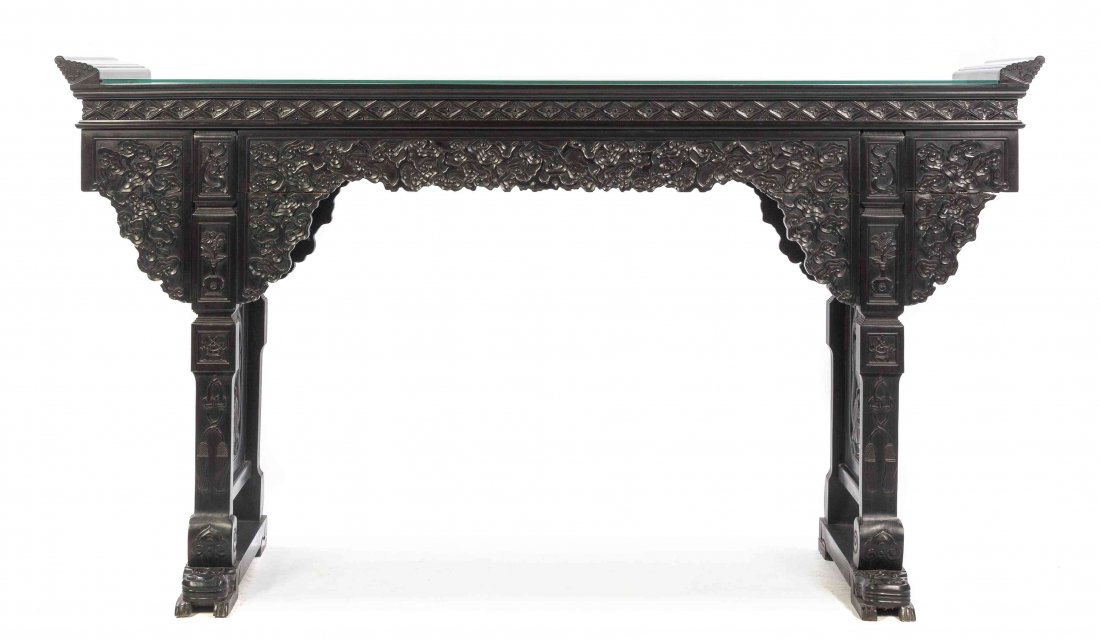A Chinese Carved Hardwood Altar Table, Height 47 x: A Chinese Carved Hardwood Altar Table, having a rectangular plank top terminating in carved, stepped flanges at both ends, above the scalloped apron depicting dense foliage in relief, raised on rectan