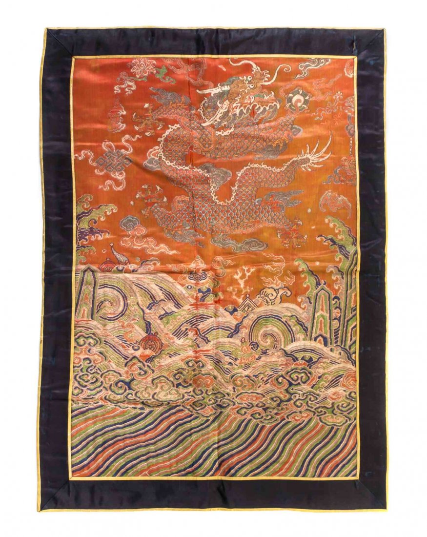 A Chinese Embroidered Apricot Silk Panel, Height 22 1/8: A Chinese Embroidered Apricot Silk Panel, likely once part of an imperial dragon robe, depicting a five claw dragon in three-quarter profile clasping a flaming pearl amongst lotus, bats, endless knot 