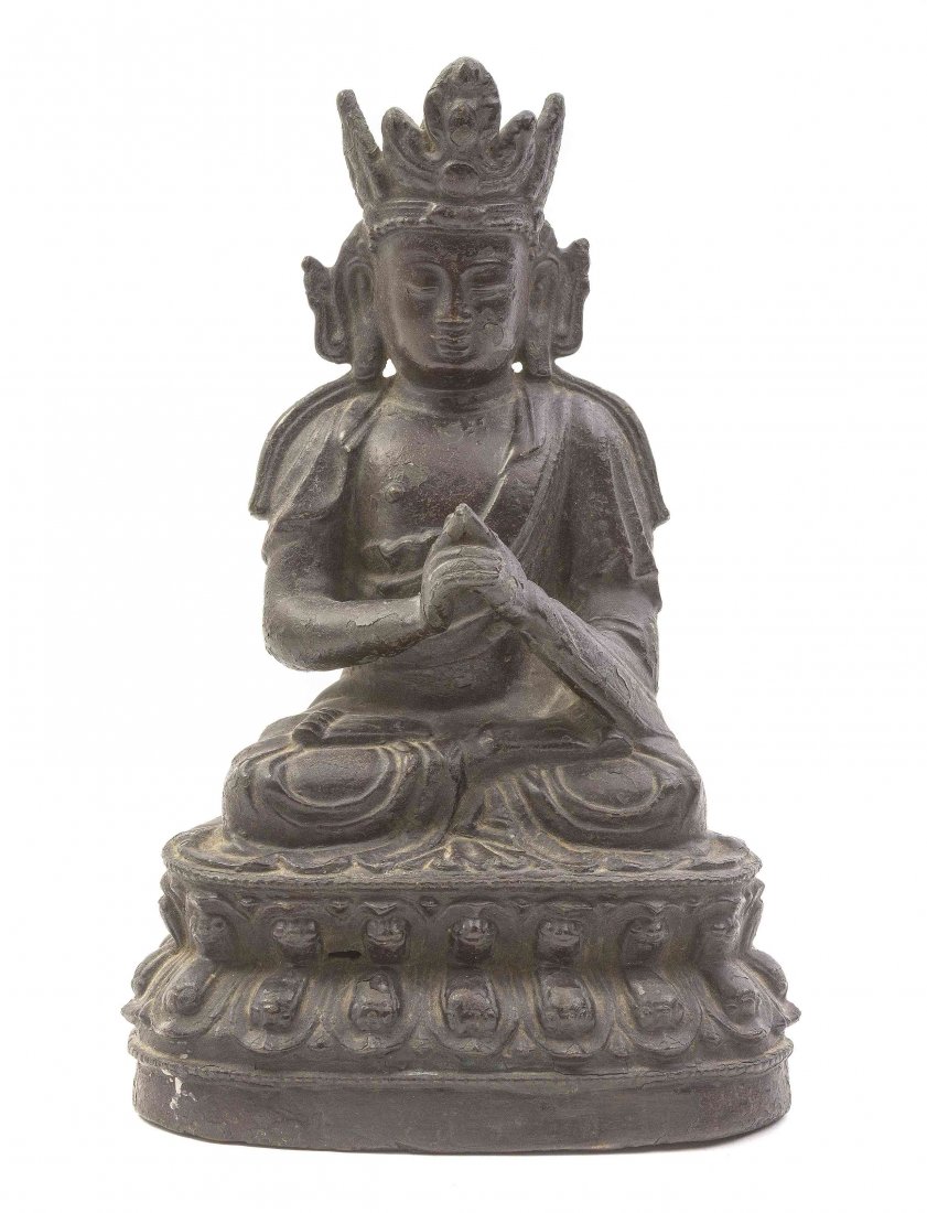 A Sino-Tibetan Bronze Figure of a Buddha, Height 9 3/4: A Sino-Tibetan Bronze Figure of a Buddha, Ming Dynasty, the figure depicted wearing a crown and robes draped about his shoulders, his hands in the mudra for supreme enlightenment, raised on a double l