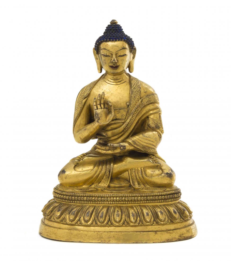 A Chinese Gilt Bronze Buddha, Height 7 3/4 inches.: A Chinese Gilt Bronze Buddha, 18th/19th century, the figure depicted with raised bosses to the hair and gilt painted ushnisha, with pleated robes and seated in dhyanasana on a tiered lotus base. Heigh