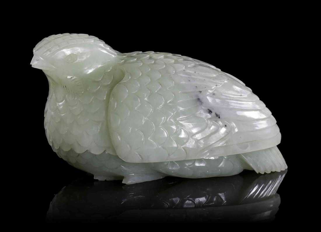 A Carved Jade Quail Box, Width 3 7/8 inches.: A Carved Jade Quail Box, of a mottled celadon colored stone, the head and wings lifting off to reveal the hollowed vessel underneath. Width 3 7/8 inches.