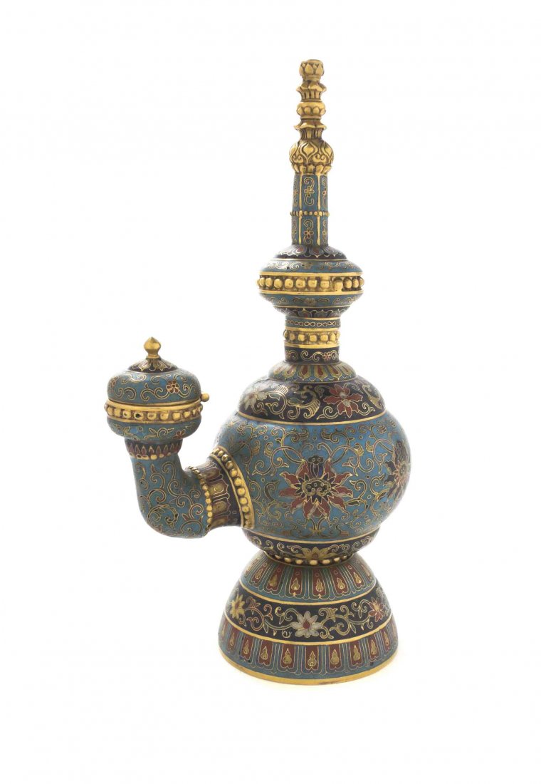 A Cloisonne Enamel Altar Article, Height 8 3/4 inches.: A Cloisonne Enamel Altar Article, having gilt metal elements, the body decorated with scrolling lotus vines on a blue ground, with bands of foliate decoration around the foot, with a circular four-cha