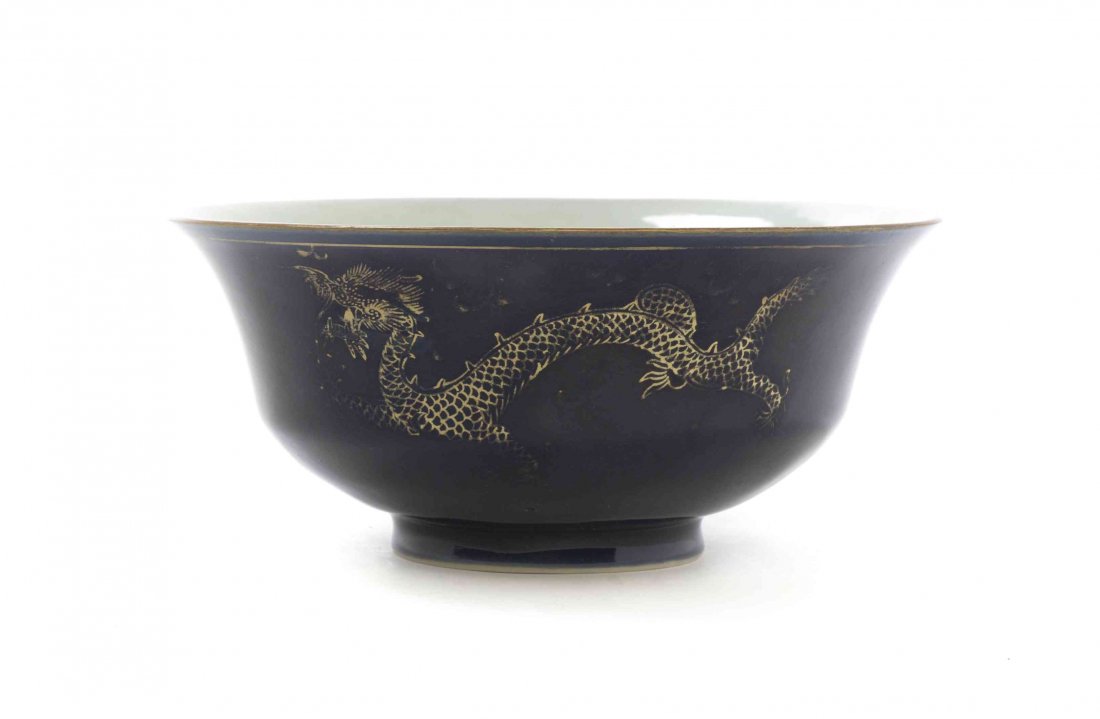 A Chinese Mazarin Blue Porcelain Bowl, Diameter 7 3/8: A Chinese Mazarin Blue Porcelain Bowl, of circular footed form with a slightly flared mouth rim, with a fired gold decoration of dragons, bearing a six-character Qianlong mark. Diameter 7 3/8 inches.
