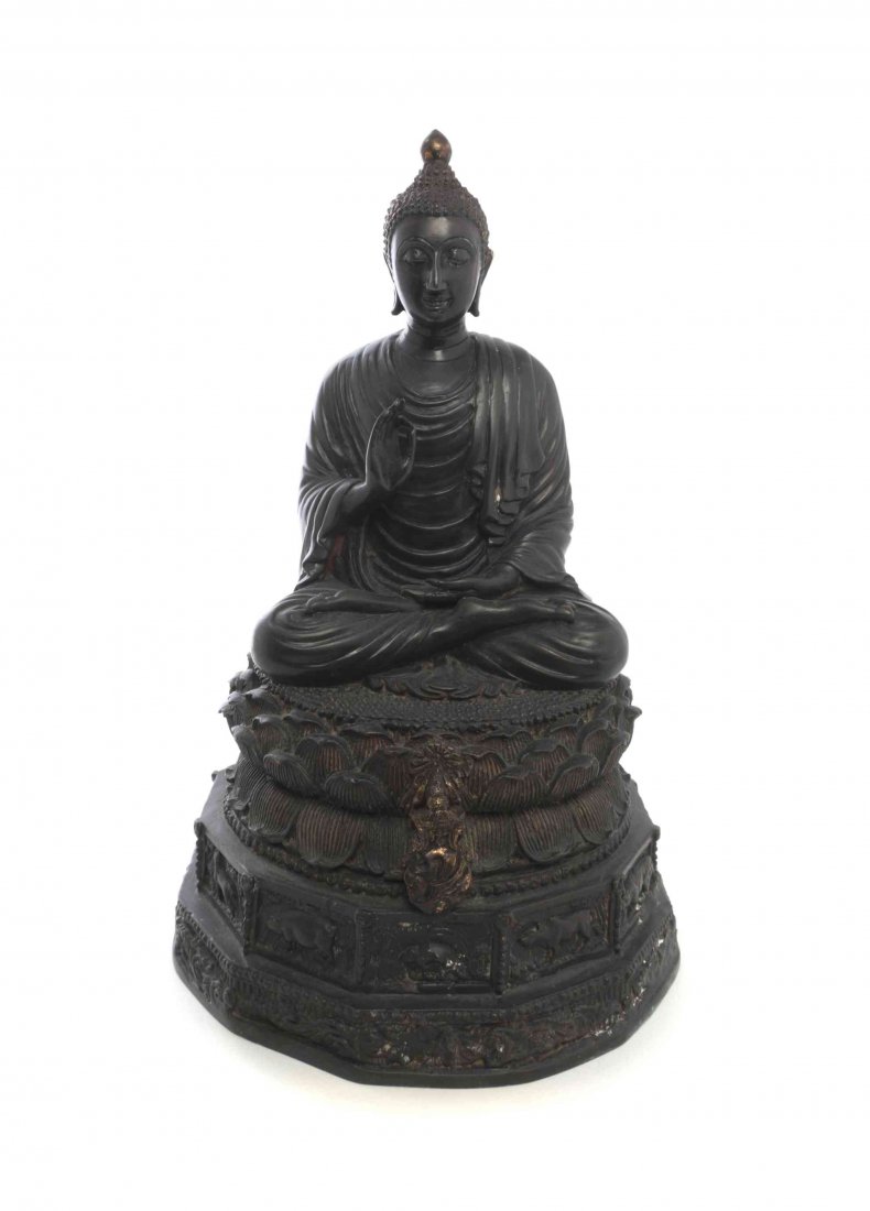 A Thai Bronze Figure of a Seated Buddha, Height 11 1/2: A Thai Bronze Figure of a Seated Buddha, the figure depicted in dhyanasana, in pleated and draped robes, having a tapered ushnisha, raised on a mat of concentric beads over a lotus form circular seat,