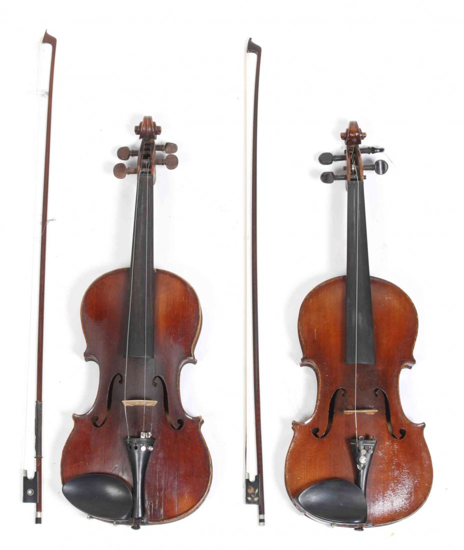A German Violin, Length of each 23 1/4 inches.: A German Violin, having a Joseph Guarnerius label to the interior, together with another example having a Marcello da Gaetano label and cased together. Length of each 23 1/4 inches.