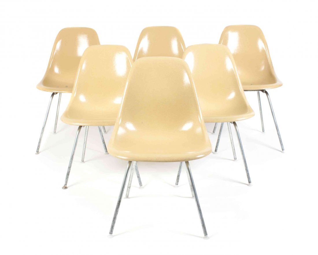 Six Charles and Ray Eames Chairs, Height 31 1/2 inches.: Six Charles and Ray Eames Chairs, yellow and raised on tubular legs. Height 31 1/2 inches.