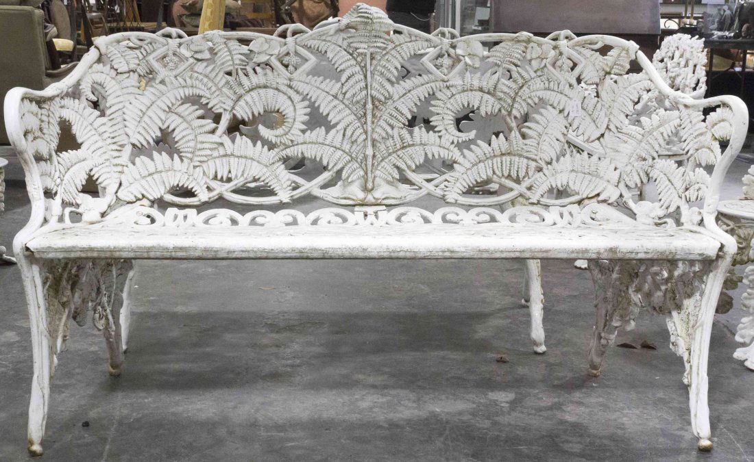 An Assembled Suite of Victorian Style Wrought Iron: An Assembled Suite of Victorian Style Wrought Iron Furniture, comprising two settees in the fern pattern and a settee and two chairs in the grapevine pattern. Width of widest 59 inches. Proper