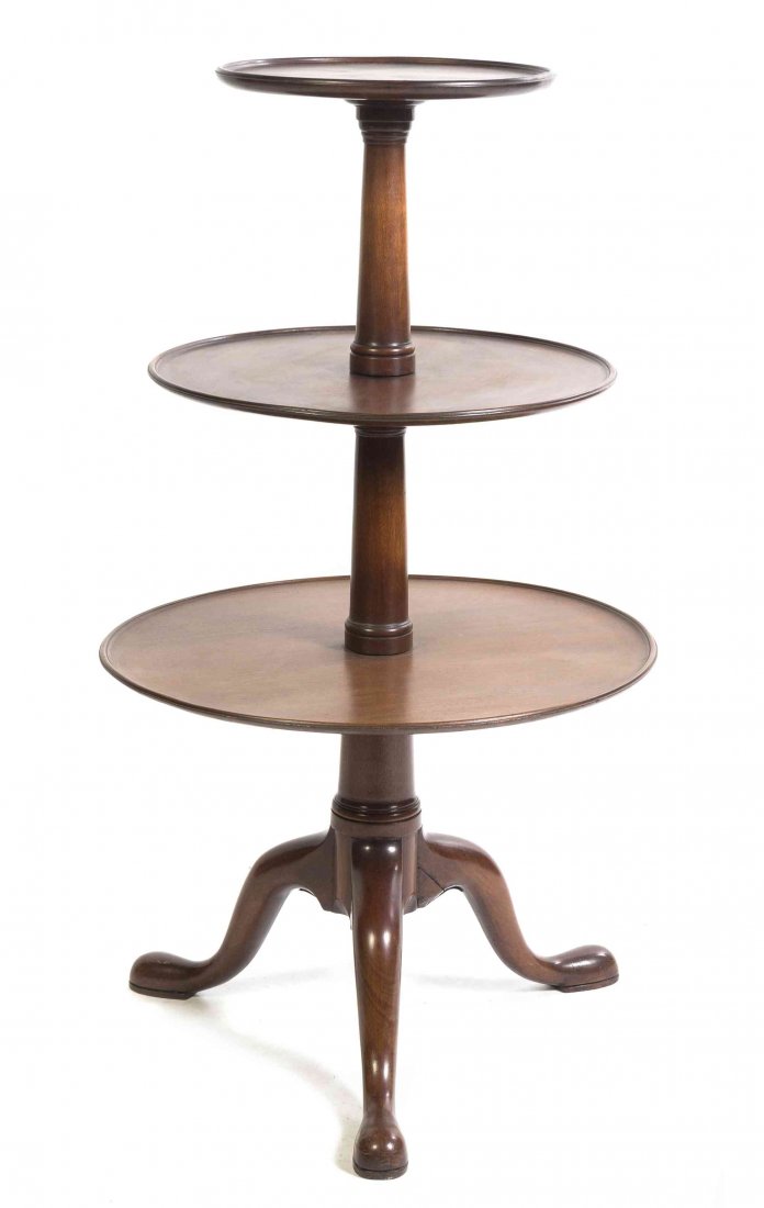A George III Style Mahogany Dumb Waiter, Height 45 x: A George III Style Mahogany Dumb Waiter, having three dished graduated tiers, raised on a tripod base. Height 45 x diameter 25 inches. Property from the Estate of Eleanor Stein Rusnak, Highland Park, 