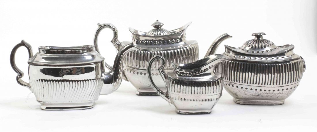 An English Lusterware Tea and Coffee Service, Width of: An English Lusterware Tea and Coffee Service, comprising a teapot, a coffee pot, a covered sugar and a creamer. Width of first 11 3/8 inches. Property from the Estate of Norman and Dorothy Holmes, Wil