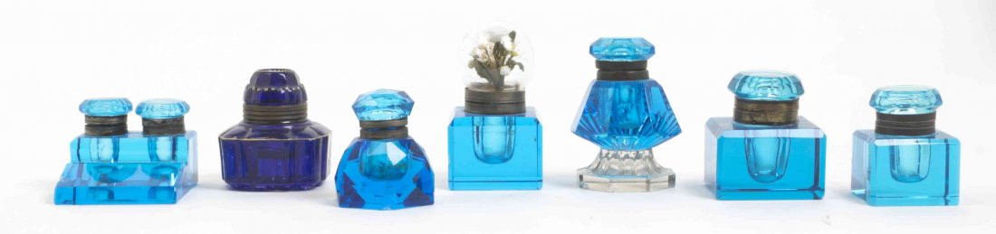 A Collection of Blue Glass Inkwells, Width of widest 3: A Collection of Blue Glass Inkwells, primarily 19th century, comprising six single and one double well examples. Width of widest 3 inches. Property from the Estate of Norman and Dorothy Holmes, Wilmet