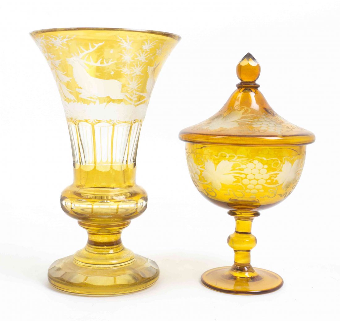 Two Bohemian Glass Cut to Clear Articles, Height of: Two Bohemian Glass Cut to Clear Articles, the first a trumpet vase, decorated with a leaping deer in a landscape, the other a compote with grape cluster and leaf decoration. Height of taller 9 1/4 inc