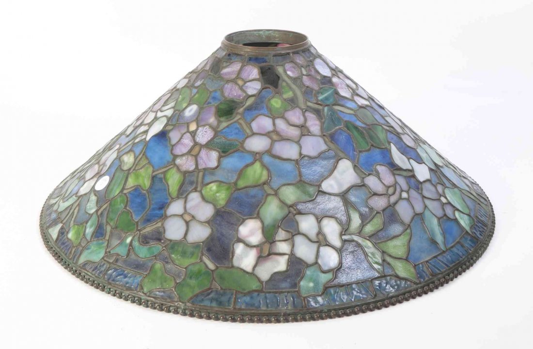 A Leaded Glass Hanging Shade, after Tiffany Studios,: A Leaded Glass Hanging Shade, after Tiffany Studios, of conical form in the Dogwood style. Diameter 27 3/4 inches.