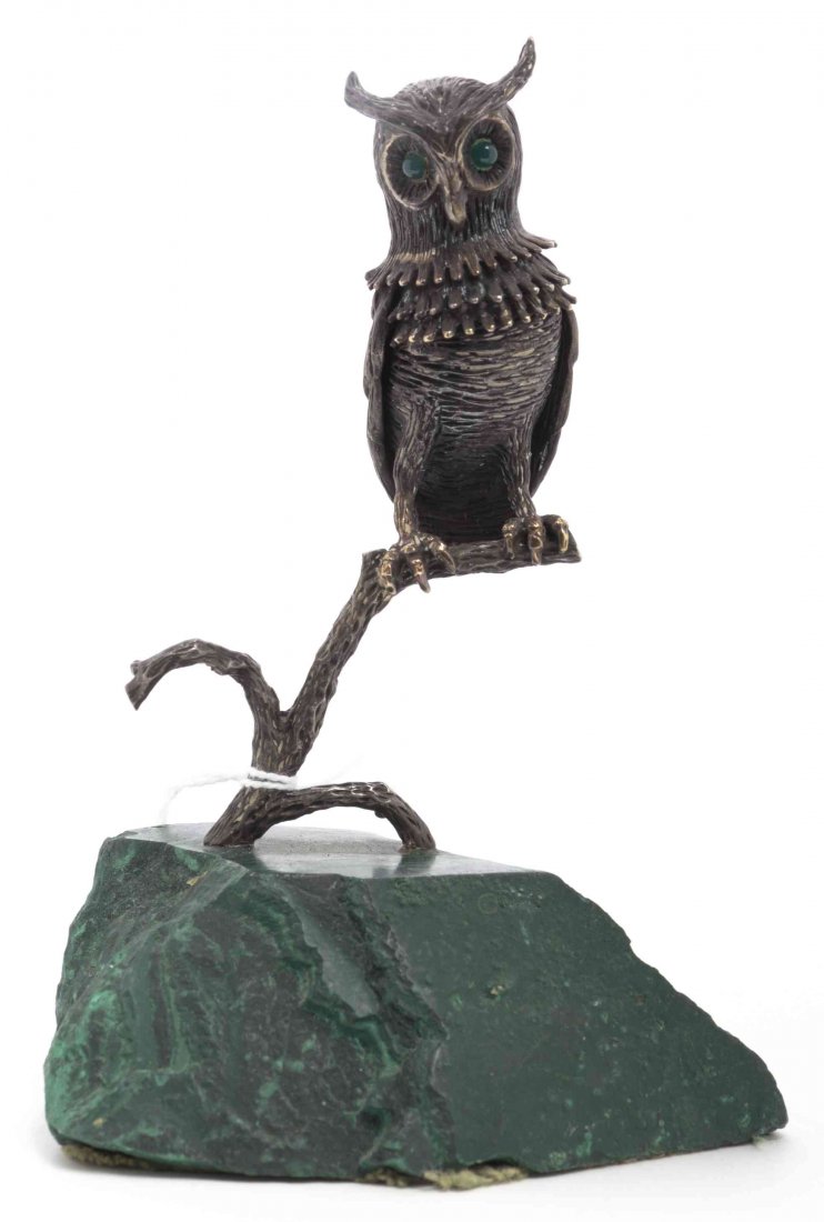 A Silver Model of an Owl, Height overall 5 1/4 inches.: A Silver Model of an Owl, having glass eyes and perched on a branch set on a malachite base. Height overall 5 1/4 inches.