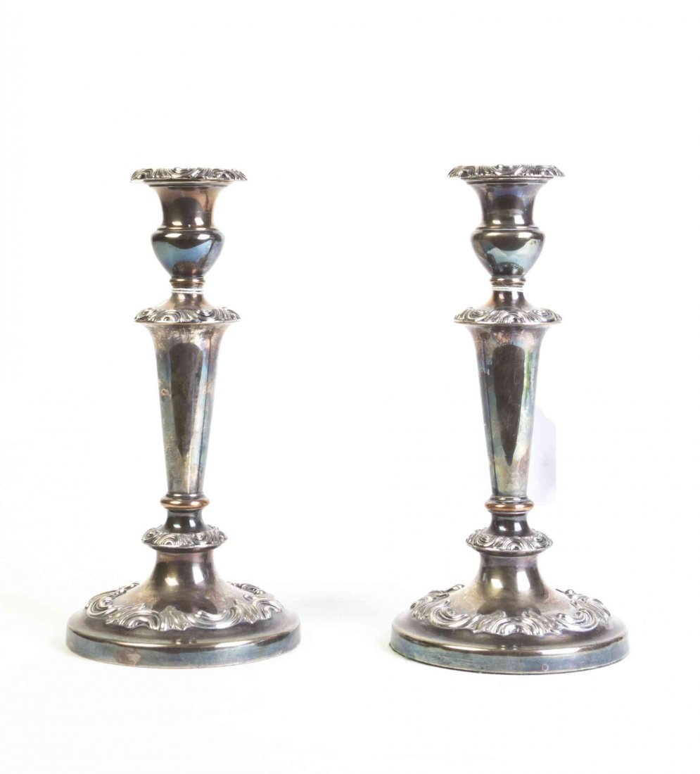 A Pair of English Silver-Plate Candlesticks, Height 9: A Pair of English Silver-Plate Candlesticks, each of baluster form with scrolling stylized foliate decoration. Height 9 inches. Property from the Estate of Norman and Dorothy Holmes, Wilmette, Illinoi