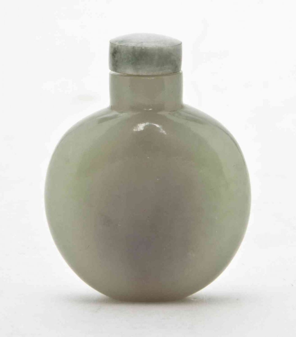 A Chinese Pale Celadon Jade Snuff Bottle, Height: A Chinese Pale Celadon Jade Snuff Bottle, of compressed flask form. Height overall 2 3/8 inches.