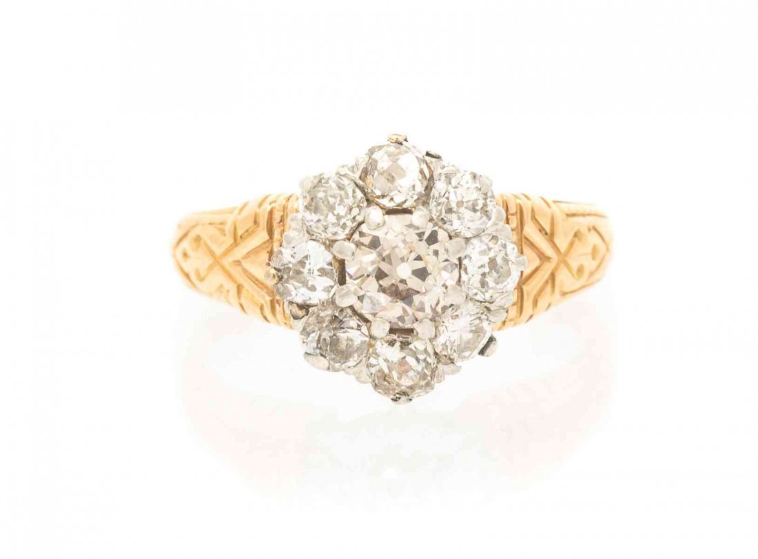 An Antique Yellow Gold and Diamond Ring, 3.00 dwts.: An Antique Yellow Gold and Diamond Ring, containing one old European cut diamond weighing approximately 0.41 carat surrounded by nine old European and round brilliant cut diamonds weighing approximate