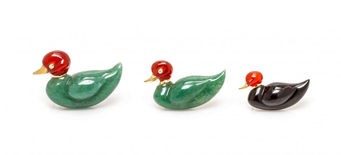 A Collection of 18 Karat Yellow Gold and Hardstone Duck: A Collection of 18 Karat Yellow Gold and Hardstone Duck Brooches, consisting of carved onyx, carnelian and aventurine quartz bodies and heads, the eyes containing round single cut diamonds. Stamp: JJ 