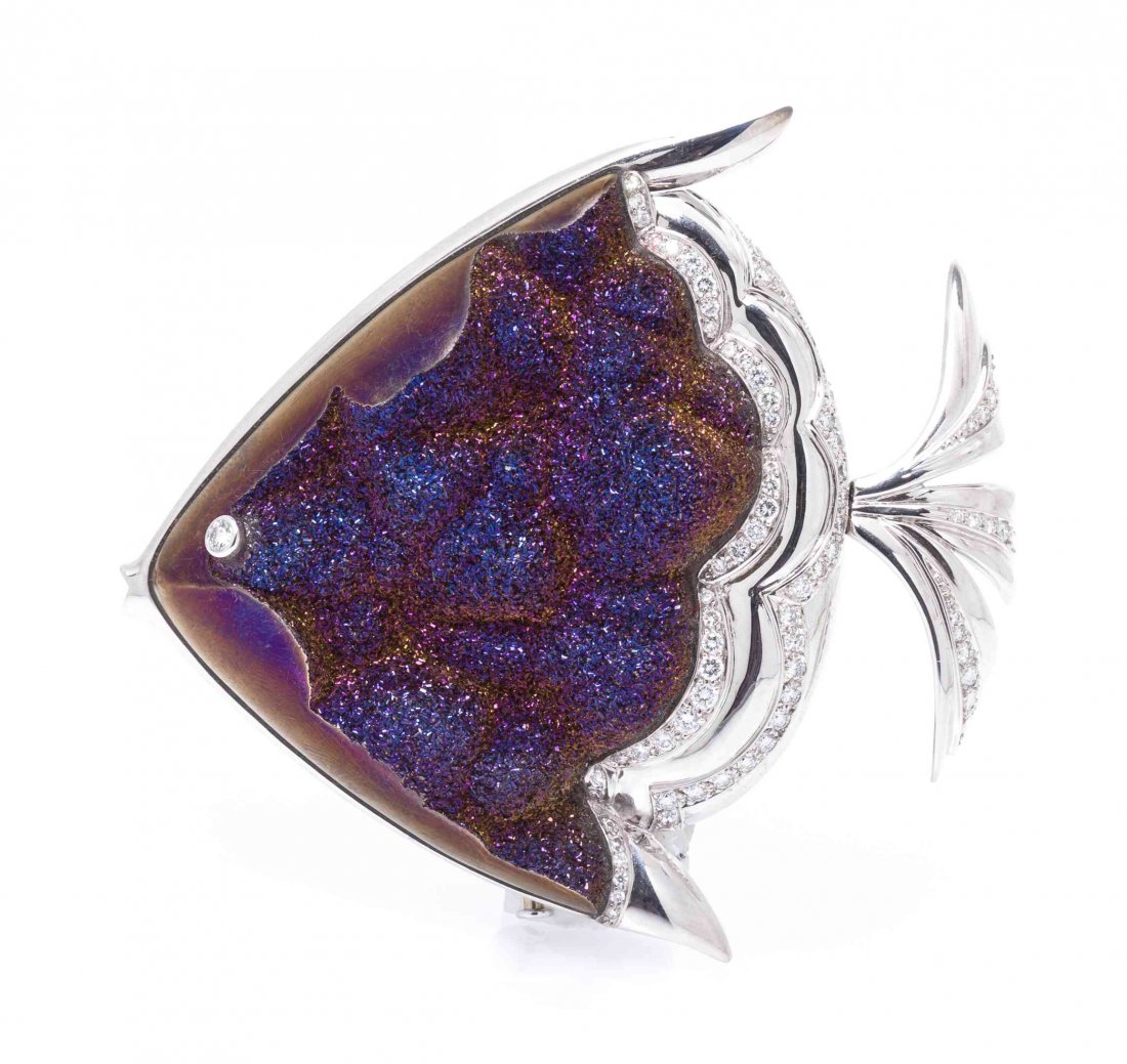 An 18 Karat White Gold, Titania Druzy Quartz and: An 18 Karat White Gold, Titania Druzy Quartz and Diamond Fish Brooch, Mauboussin, containing one freeform plaque of druzy quartz and numerous round brilliant cut diamonds weighing approximately 1.00 c