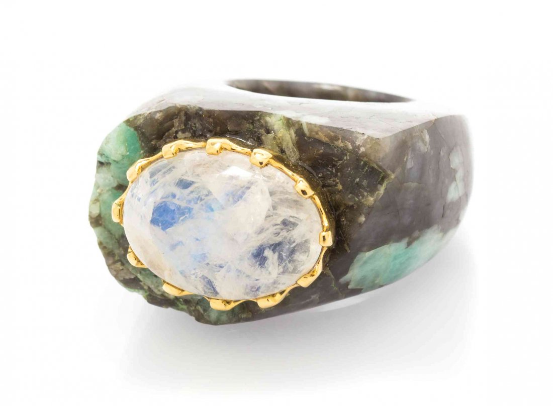 An 18 Karat Yellow Gold, Labradorite and Carved: An 18 Karat Yellow Gold, Labradorite and Carved Hardstone Ring, Tony Duquette, consisting of a sculpted mottled green and grey hardstone ring base surmounted with an oval cabochon cut labradorite meas