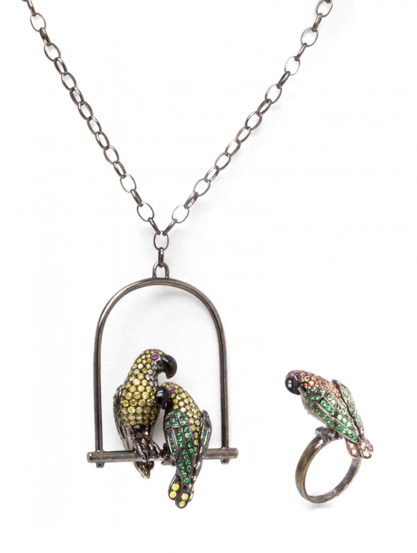 An 18 Karat Gold, Onyx and Multi Gem Demi Parure, 27.65: An 18 Karat Gold, Onyx and Multi Gem Demi Parure, consisting of a matching necklace and ring in a perched parrot motif, the set constructed in black rhodium plated gold, the necklace pendant containin