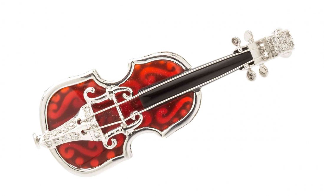An 18 Karat White Metal, Carnelian, Onyx and Diamond: An 18 Karat White Metal, Carnelian, Onyx and Diamond Violin Pendant/Brooch, consisting of a carved carnelian body, carved onyx neck and containing numerous round brilliant cut diamonds weighing approx