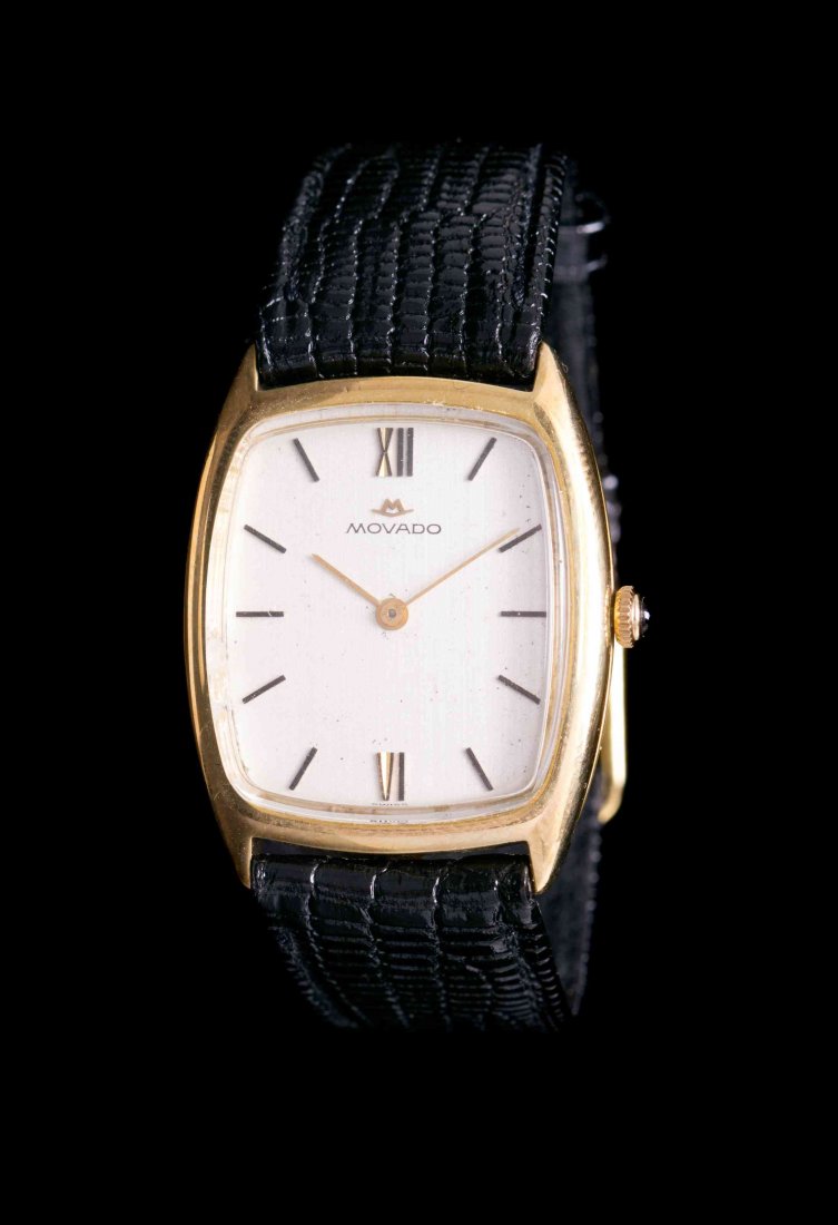 An 18 Karat Yellow Gold Wristwatch, Movado, Circa 1955,: An 18 Karat Yellow Gold Wristwatch, Movado, Circa 1955, 31.00 x 28.00 mm case dimensions exclusive of lugs, vertically brushed silvered dial signed MOVADO, applied gilt Roman and baton numerals, gilt
