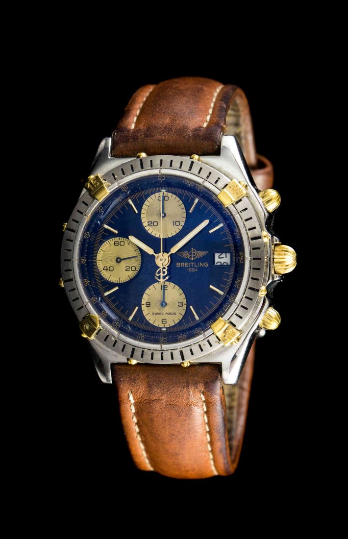 A Stainless Steel and Gold Ref. B13048 Chronomat: A Stainless Steel and Gold Ref. B13048 Chronomat Chronograph Wristwatch, Breitling, sold February 23, 1994, 39.00 mm case diameter, blue dial signed BREITLING, applied silvered baton numerals with out
