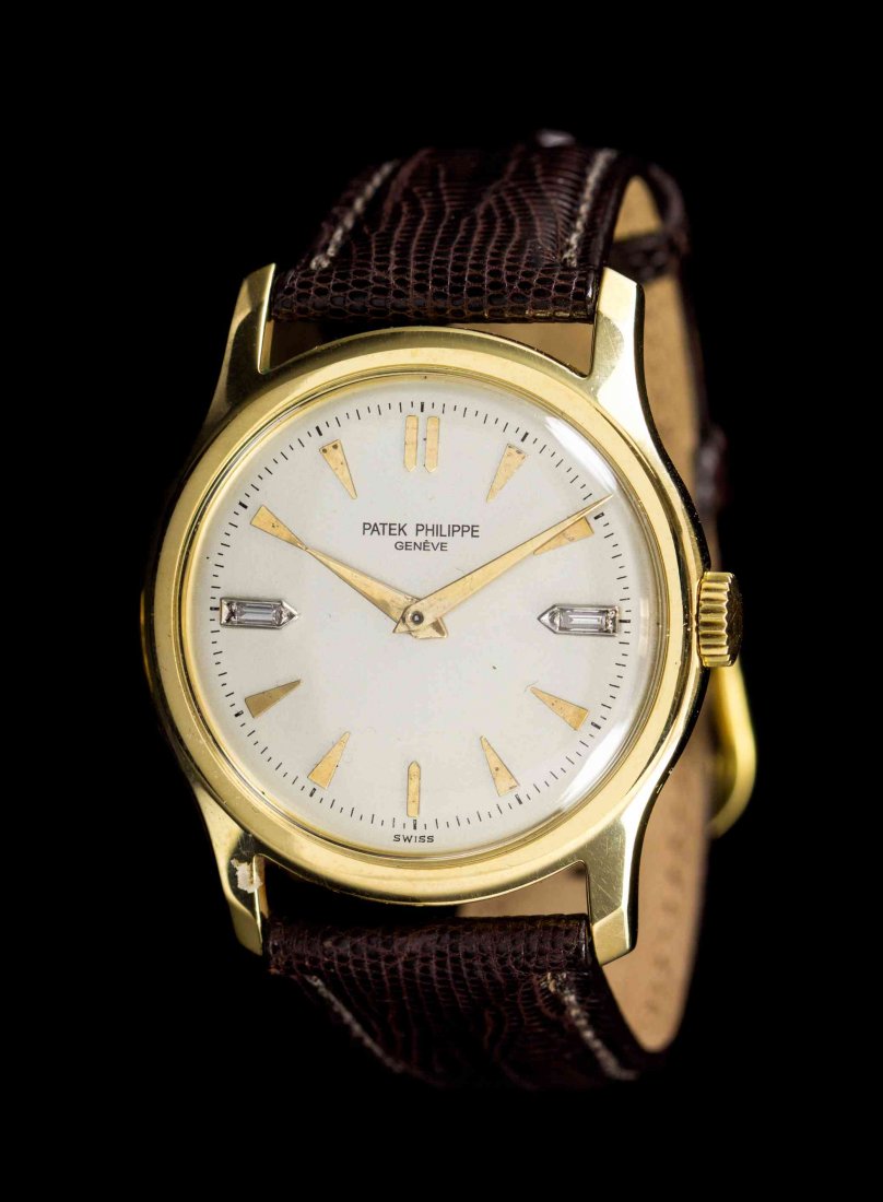 An 18 Karat Yellow Gold and Diamond Ref. 2448: An 18 Karat Yellow Gold and Diamond Ref. 2448 Wristwatch, Patek Philippe, Circa 1949, 35.00 mm case diameter, matte silvered dial signed PATEK PHILIPPE, applied yellow gold arrow and baton numerals wi