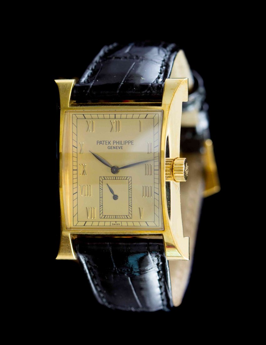 An 18 Karat Yellow Gold Ref. 5500J Pagoda Wristwatch,: An 18 Karat Yellow Gold Ref. 5500J Pagoda Wristwatch, Patek Philippe, Circa 1997, produced in a limited edition of 1100 in yellow gold, 41.00 x 29.00 mm case dimensions, champagne dial signed PATEK PH