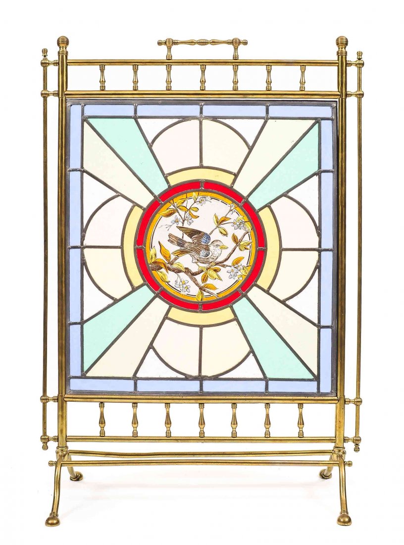 A Victorian Brass, Stained and Caned Glass Fireplace: A Victorian Brass, Stained and Caned Glass Fireplace Screen, late 19th/early 20th century, the brass frame enclosing colored, stained, and caned glass screen centered by a roundel with decoration of a