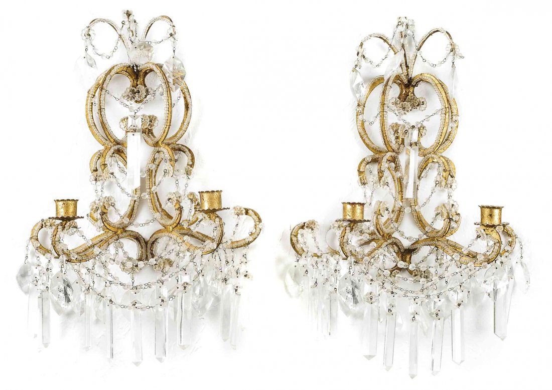 A Pair of Victorian Gilt Metal and Glass Two-Light Wall: A Pair of Victorian Gilt Metal and Glass Two-Light Wall Sconces, each having a C-scroll backplate issuing two candle arms and supporting drop-lusters. Height 19 inches.
