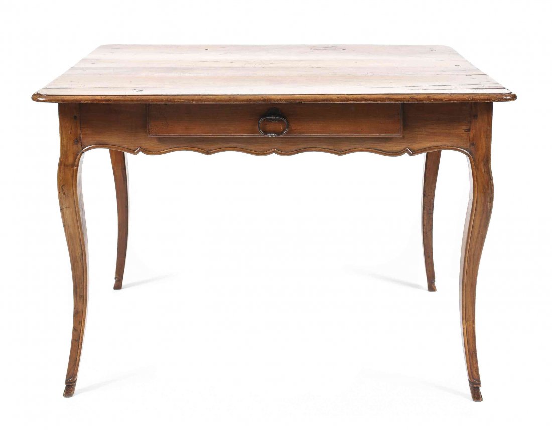 A French Provincial Walnut Work Table, Height 29 3/4 x: A French Provincial Walnut Work Table, having a rectangular top over a foliate scroll carved frieze and single drawer, raised on cabriole legs. Height 29 3/4 x width 41 3/4 x depth 29 1/2 inches.