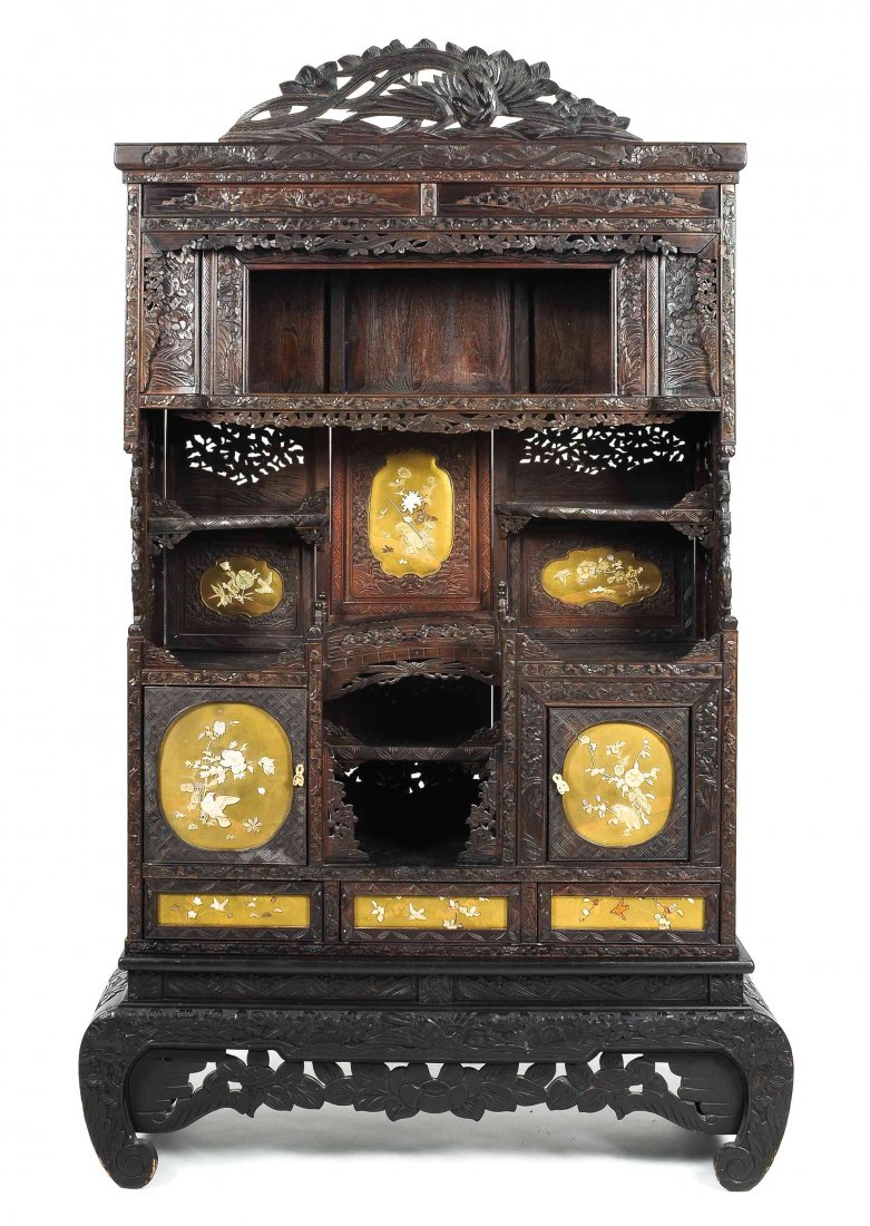 A Japanese Rosewood Inlaid Shodana Cabinet, Height 77 x: A Japanese Rosewood Inlaid Shodana Cabinet, having a molded cornice over the carved frieze, with relief carved foliate decoration throughout, with inlaid gilt lacquer panels having bone and mother-of-