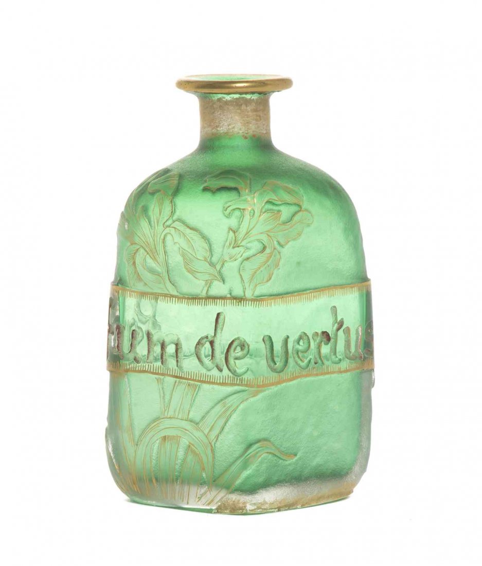 A Daum Cameo Glass Perfume Bottle, Height 4 3/8 inches.: A Daum Cameo Glass Perfume Bottle, circa 1900, of diamond form, with foliate decoration on a green ground and gilt highlights throughout, having a central band reading Parfum de Vertus, with an etched