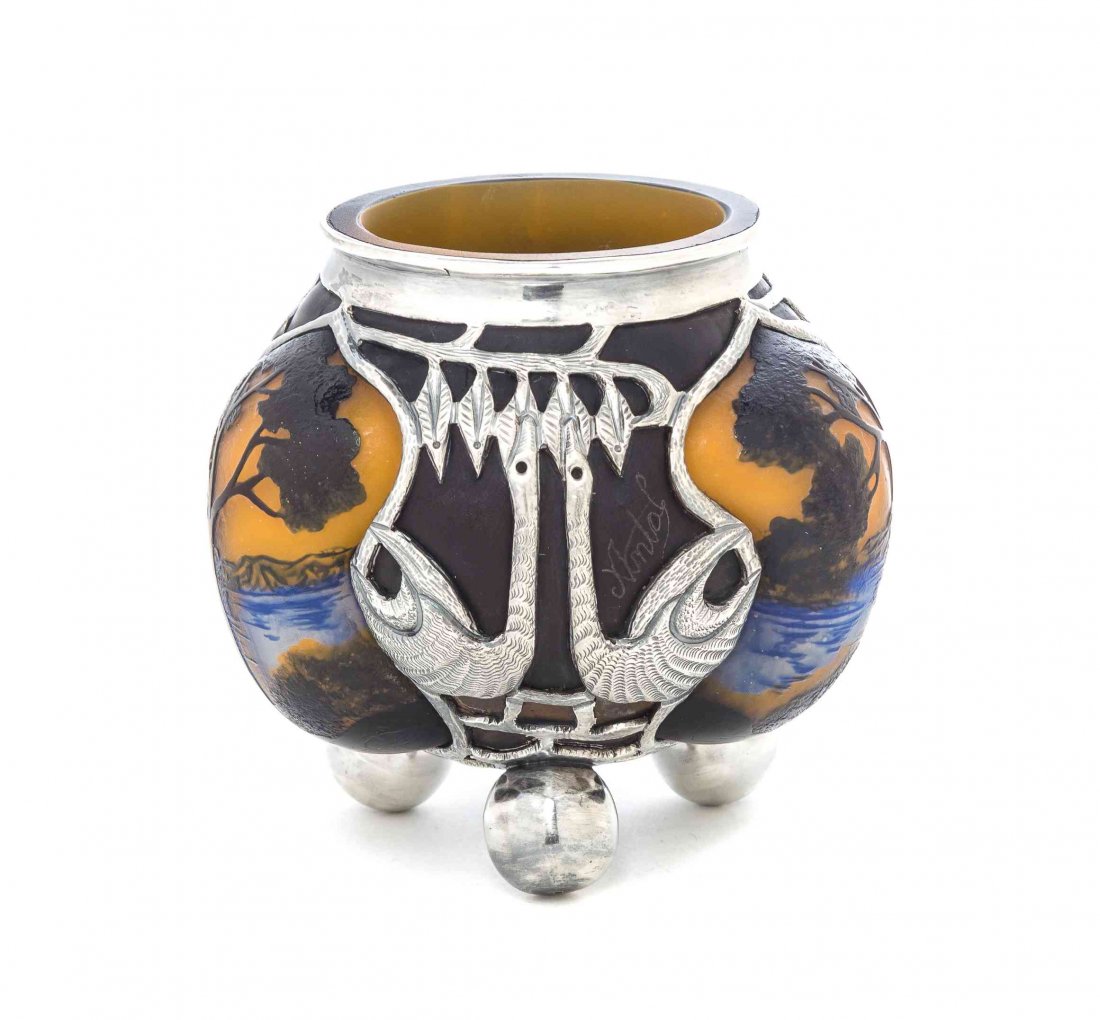 A Mohr LF Cameo Glass and Continental Silvered Metal: A Mohr LF Cameo Glass and Continental Silvered Metal Mounted Vase, of lobed triangular form with landscape decoration, the silvered mounts in the form of exotic birds signed Mohr LF, raised on three s