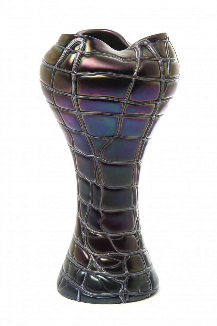 A Czech Iridescent Glass Vase, likely Pallme Konig,: A Czech Iridescent Glass Vase, likely Pallme Konig, of tapering form with a pinched rim and threading throughout. Height 10 3/4 inches. Property from the Estate of Louis M. and Linda M. Byron, Tucson,