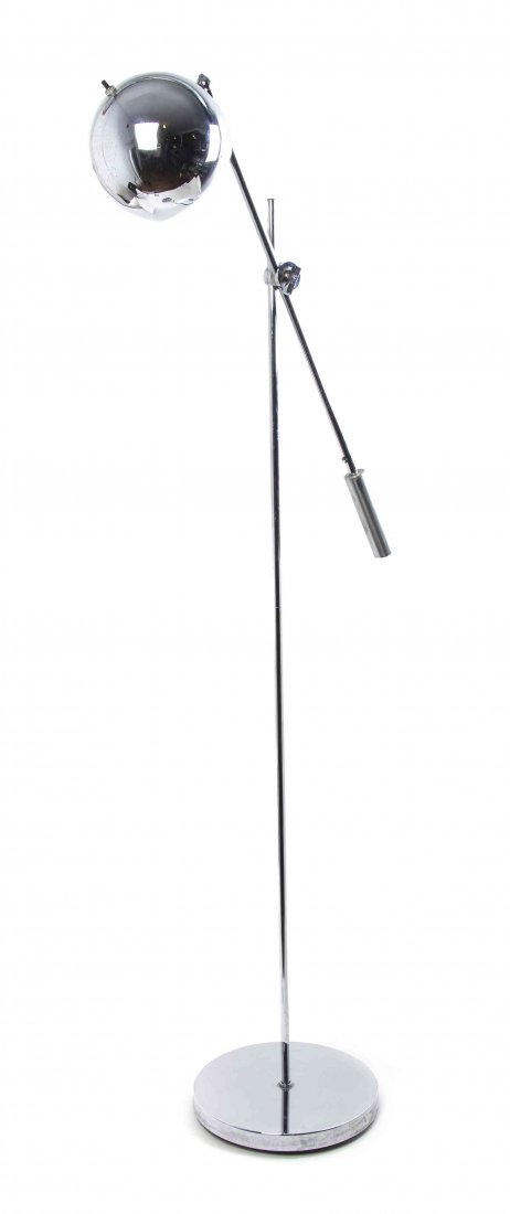 An American Chromed Floor Lamp, Robert Sonneman, Height: An American Chromed Floor Lamp, Robert Sonneman, the shade of spherical form with an adjustable arm, raised on a tubular standard over a circular foot. Height of base 52 1/2 inches.