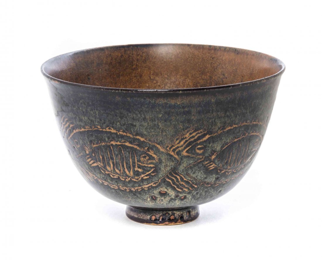 An American Ceramic Bowl, Mary Scheier (1908-2007),: An American Ceramic Bowl, Mary Scheier (1908-2007), of ribbed tapering form with a continuous band of fish, raised on a circular foot, incised Scheier. Diameter 5 3/4 inches.