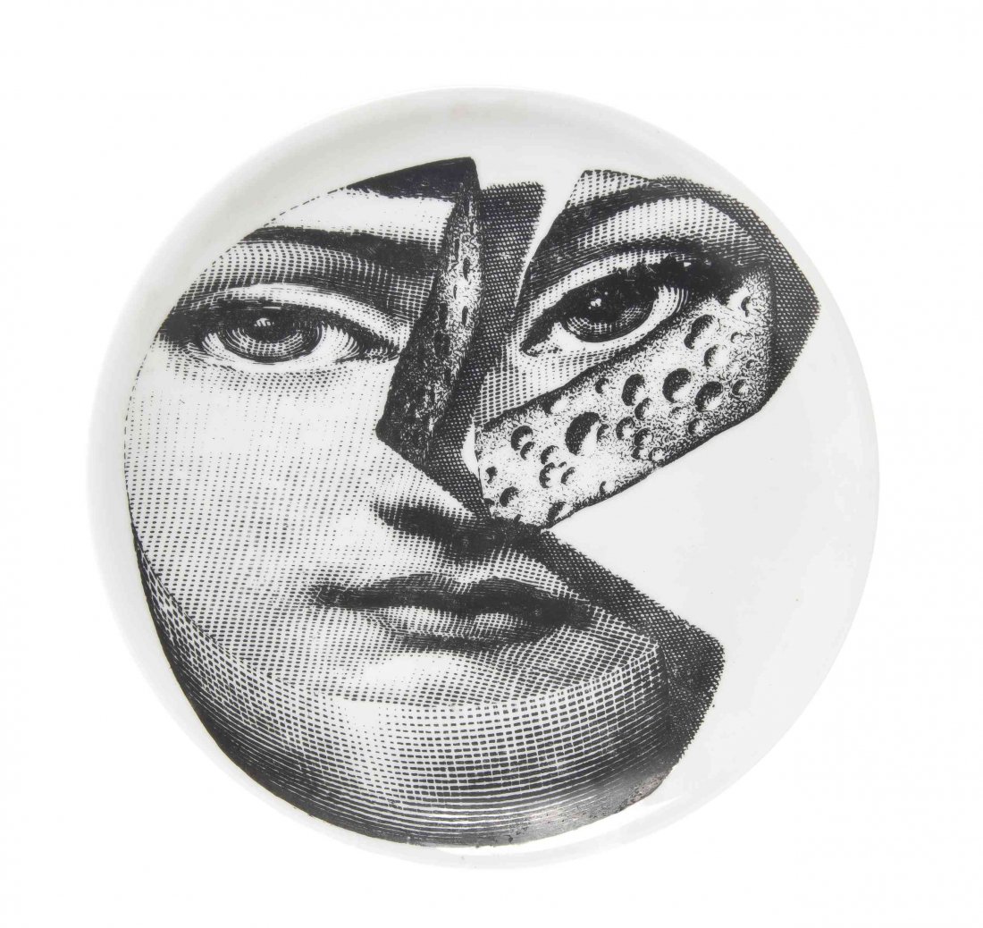 A Piero Fornasetti Porcelain Plate, Italian: A Piero Fornasetti Porcelain Plate, Italian (1913-1988), for Rosenthal, of circular form depicting the face of a woman in the form of a wedge of cheese. Diameter 10 1/4 inches. Property from the Colle