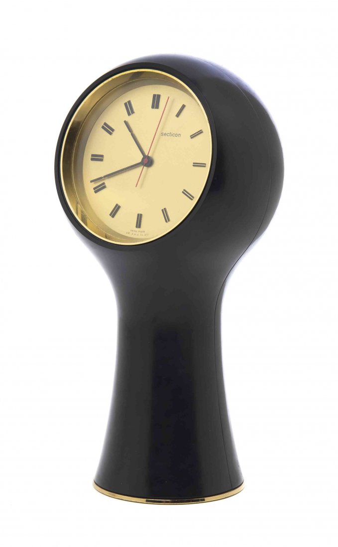 An Italian Molded Plastic and Brass Table Clock, Angelo: An Italian Molded Plastic and Brass Table Clock, Angelo Mangiarotti (1921-2012), for Secticon, having a circular dial within a black case. Height 9 1/2 inches.