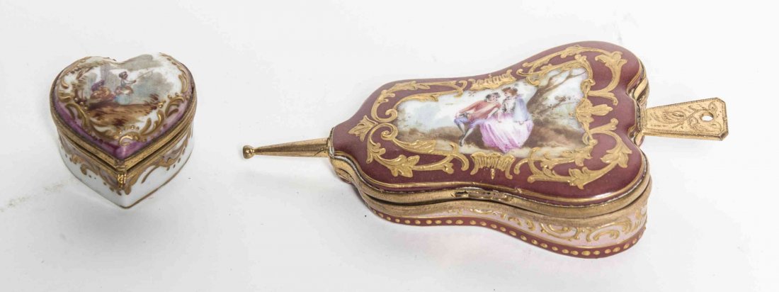 Two Meissen Porcelain Boxes, Width of wider 4 1/2: Two Meissen Porcelain Boxes, comprising one of heart shape, the other in the form of bellows, each with figural and gilt decoration. Width of wider 4 1/2 inches.