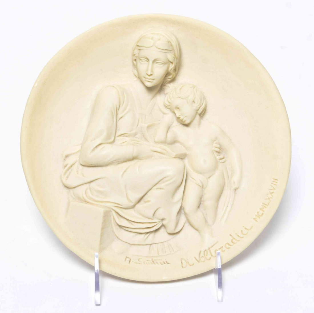 An Italian Alabaster Roundel, Diameter 8 1/2 inches.: An Italian Alabaster Roundel, LAST QUARTER 20TH CENTURY, STUDIO DANTE DI VOLTERADICI, depicting Pensive Madonna from the Living Madonnas collection, together with the original box. Diameter 8 1/2 inch