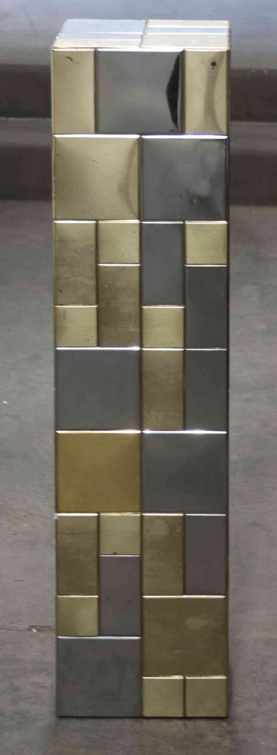 A Chrome and Brass Pedestal, Height 34 inches.: A Chrome and Brass Pedestal, IN THE STYLE OF PAUL EVANS, in the Cityscape pattern, of rectangular form. Height 34 inches.