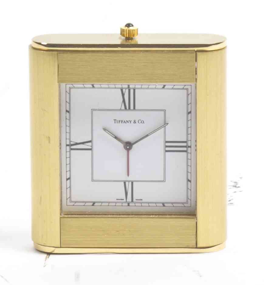 A Tiffany and Company Desk Clock, Height 2 1/8 inches.: A Tiffany and Company Desk Clock, of rectangular form with rounded corners, having a square dial with Roman numerals. Height 2 1/8 inches. Property of a Palm Beach Estate