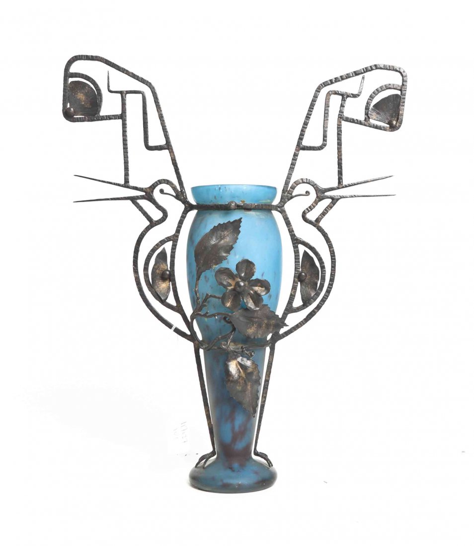 A Muller Freres Glass and Iron Mounted Vase, Height of: A Muller Freres Glass and Iron Mounted Vase, the mottled glass of tapering form, etched Muller Freres Luneville, within bird form handles with floral decoration. Height of glass 11 7/8 inches.