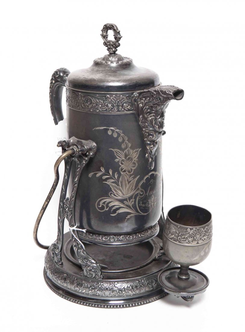 An American Silver-Plate Pitcher on Stand with Goblet,: An American Silver-Plate Pitcher on Stand with Goblet, Homan Silver Plate Co., Cincinnati, OH, the body with chased decoration and presentation inscription dated June 6, 1902, pitcher tilts forward on