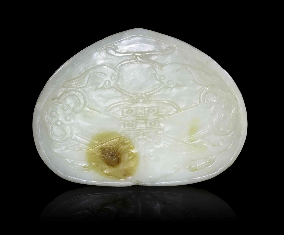 A Chinese Jade Ruyi Scepter Plaque, Width 3 7/8 inches.: A Chinese Jade Ruyi Scepter Plaque, of a near-white stone with amber inclusions, of lingzhi fungus head form, relief carved with auspicious emblems, having a beast mask above the central double happin